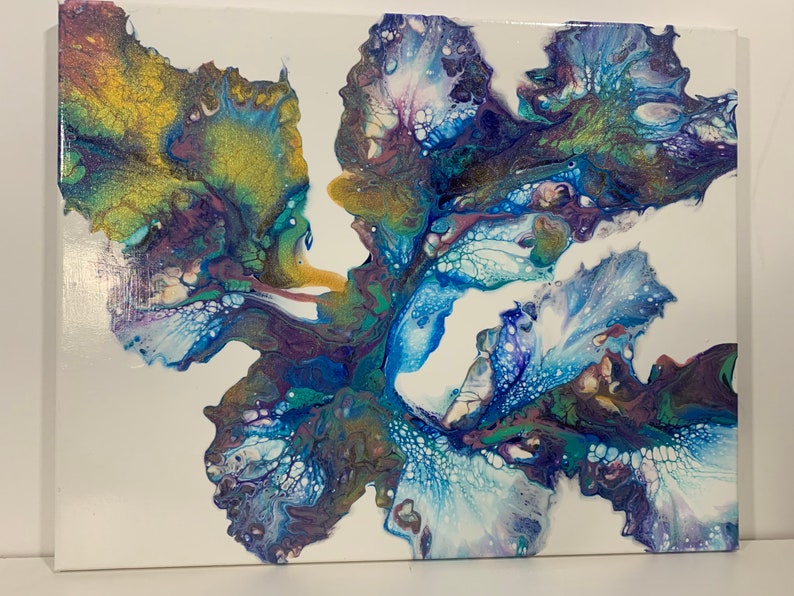 May include: Abstract painting on canvas with blue, white, purple, and gold paint. The paint is swirled and layered to create a unique design.