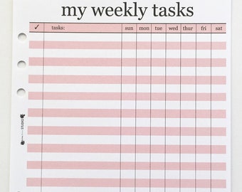 May include: A pink and white weekly task planner sheet with the text "my weekly tasks" at the top. The planner has a grid layout with columns for each day of the week and rows for tasks. The sheet is hole-punched for binder use.
