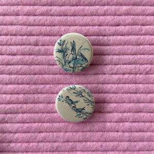 Bunnies and Birds Button Pins Set of 2 / Recycled Book Page Button Pins / Bunnies and Birds Illustration Pins / 1.25 inch