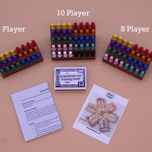 May include: Three wooden game boards with colorful push pins, labeled 6 Player, 8 Player, and 10 Player. A deck of training cards and a game board diagram are also included.