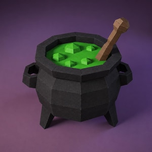 Może przedstawiać: Czarny kociołek wykonany z papieru w stylu low-poly, posiadający trzy nóżki i dwa boczne uchwyty. Wnętrze wypełnione jest jaskrawozielonym płynem z kilkoma małymi, wypukłymi bąbelkami. W środku znajduje się brązowe mieszadło.