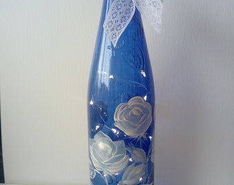 Hand painted blue wine bottle filled with LED fairy lights