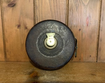 Vintage leather and brass tape measure