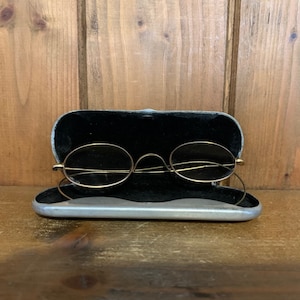 a pair of vintage Gold metal spectacles, glasses, spectacles, vintage clothing, clothing accessories, film prop