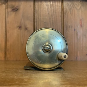 Vintage Salmon Fly Fishing Reel with Brass and Bakelite Face