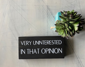 Very uninterested in that opinion - wood mini sign