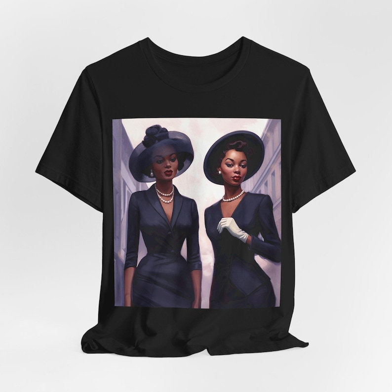 May include: Two women in black suits and hats walk down a street. They are both smiling and looking at the camera. The woman on the left is wearing a blue hat with a white band, and the woman on the right is wearing a black hat with a white band.