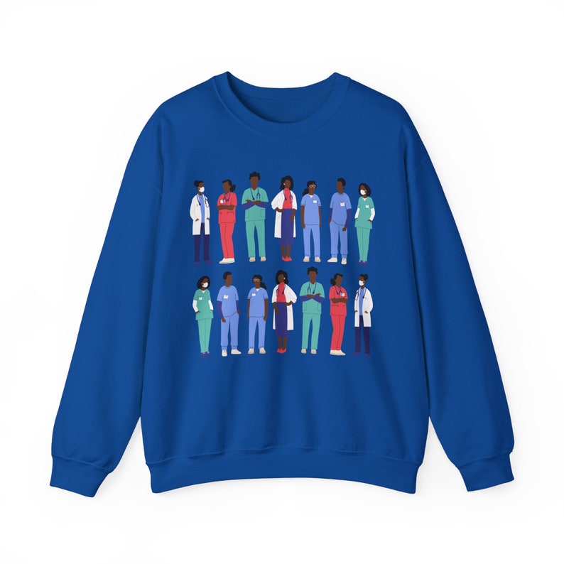 May include: A royal blue sweatshirt with a graphic print of a diverse group of healthcare workers wearing scrubs, lab coats, and face masks. The workers are standing in two rows, with their arms crossed or holding medical equipment.