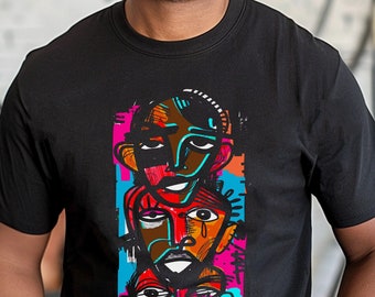 May include: Black t-shirt featuring a colourful abstract design of three stacked faces. The faces are drawn in a bold, graphic style with bright colours and black outlines.