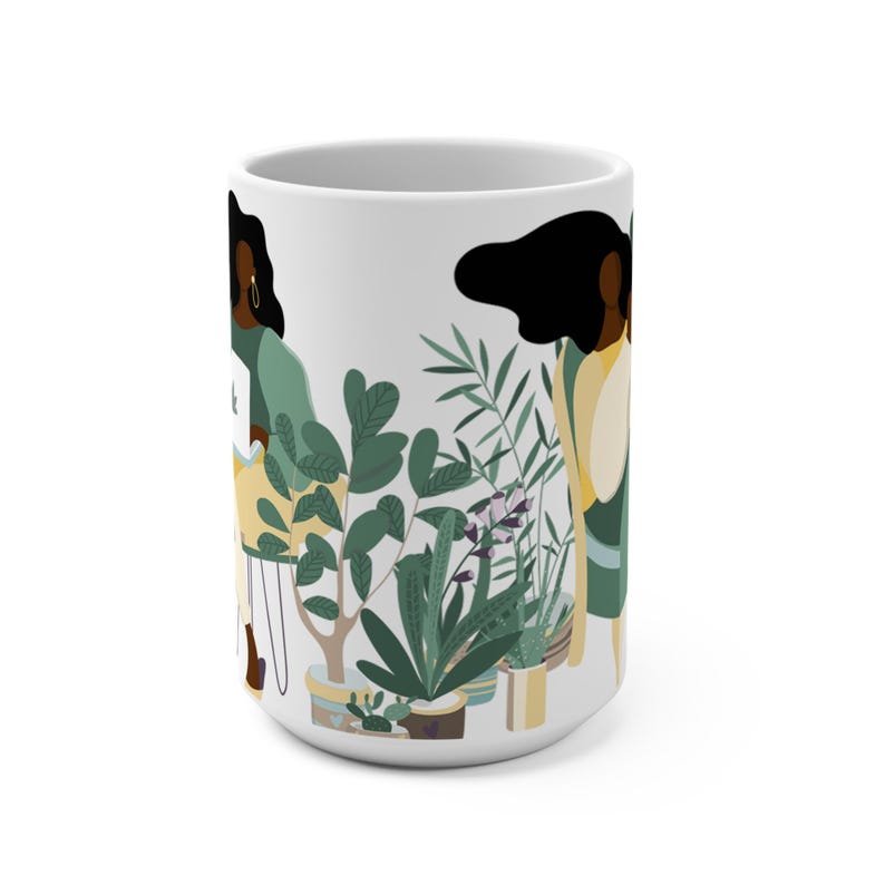 May include: White ceramic mug with a colorful illustration of two women standing next to potted plants. The women have dark skin and are wearing green and yellow clothing. The plants are green and have pink flowers.