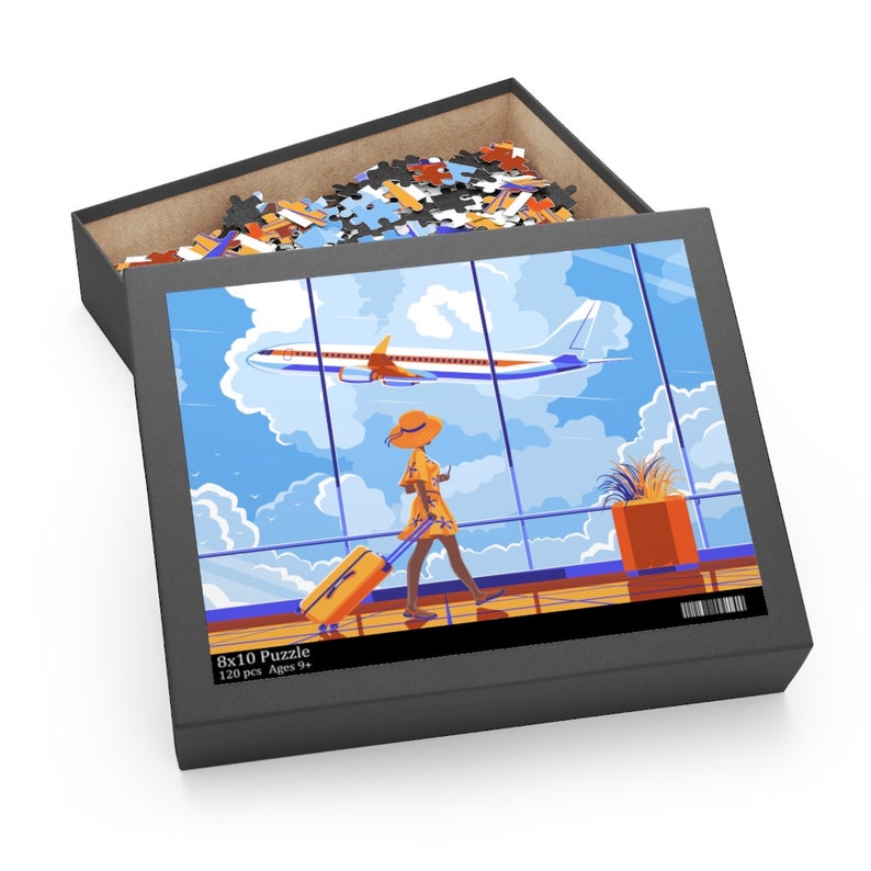 May include: A 120 piece jigsaw puzzle featuring a woman in a yellow dress and a straw hat walking through an airport terminal with a suitcase. The puzzle box shows a picture of the woman walking past a window with a plane flying in the sky. The box says "8x10 Puzzle 120 pcs Ages 9+"