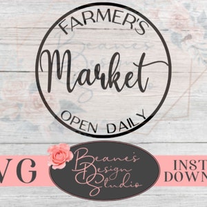 May include: Black and white circle design with the text "Farmer's Market Open Daily".