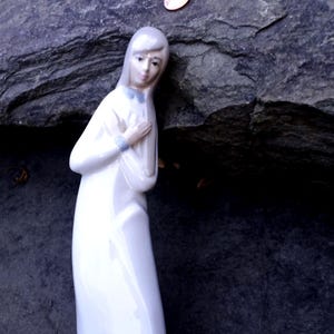 Vintage Casades Girl Standing in Prayer with Hands Crossed, Spain