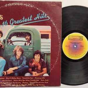 Vintage 1971 Vinyl Record Album by The Grass Roots titled Their 16 Greatest Hits