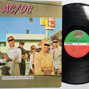 Vintage Vinyl 1976 Record Album by AC DC titled Dirty Deeds Done Dirt Cheap
