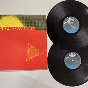 Vintage 1980 Vinyl Record Album by REO Speedwagon titled A Decade Of Rock And Roll 1970 To 1980