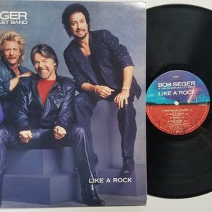 Vintage 1986 Vinyl Record Album by Bob Seger & The Silver Bullet Band titled Like A Rock