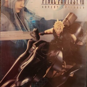 May include: DVD case for Final Fantasy VII: Advent Children. The cover features two characters with long hair, one with silver hair and the other with spiky blonde hair. The blonde-haired character is riding a black motorcycle.