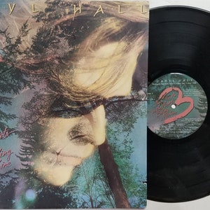 Vintage 1986 Vinyl Record Album by Daryl Hall titled Three Hearts In The Happy Ending Machine