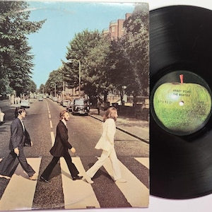 Vintage Vinyl Record Album by The Beatles titled Abbey Road