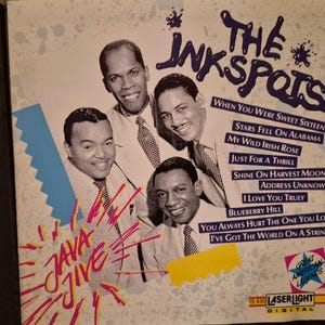 May include: A CD cover for The Ink Spots featuring a photograph of four men in suits and ties. The text includes the group name, the title Java Jive, a tracklist of ten songs, and the LaserLight Digital logo with Great American Legends text.
