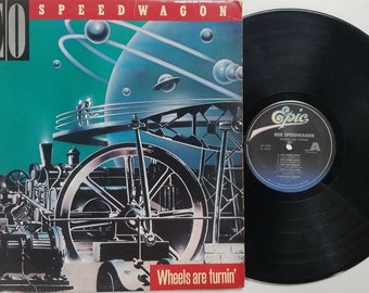 Vintage 1984 Vinyl Record Album by REO Speedwagon titled Wheels Are Turnin'