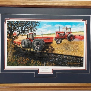 Framed 21 x 27 in Oak  International   art Print titled Autumn Field Work by Russell Sonnenberg.