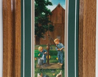 Framed in Solid Oak 16 x 9 Water Well Kids art print by Charles Freitag titled Helping Hands