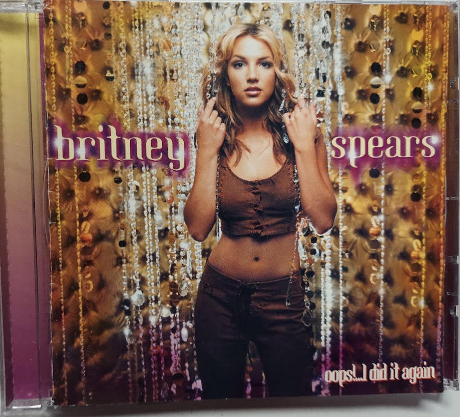 Again britney. Oops!...i did it again. Бритни упс ай дид ИТ эгейн. Britney Spears oops!... I did it again (2000) обложка. Britney Spears stronger пластинка.