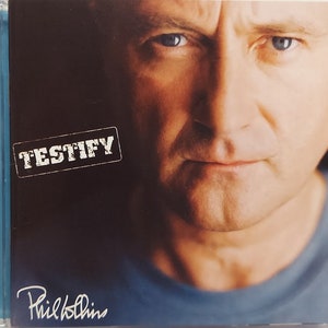 CD Used  2002 Vintage Music by Phil Collins titled Testify