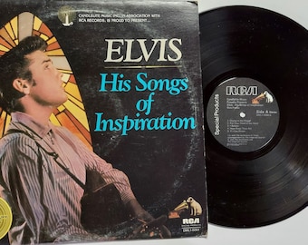 May include: A black vinyl record album cover featuring Elvis Presley with a stained glass window behind him. The album title is "Elvis His Songs of Inspiration" and the record label is RCA. An authentic golden treasury collectors edition.