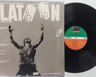 Vintage 1987 Vinyl Record Album by Various Artists titled Platoon (Original Motion Picture Soundtrack)