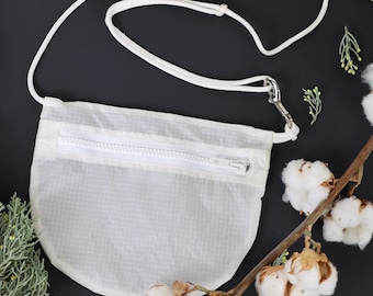 White upcycled chestbag for capsule wardrobes, Made in Europe from paragliders