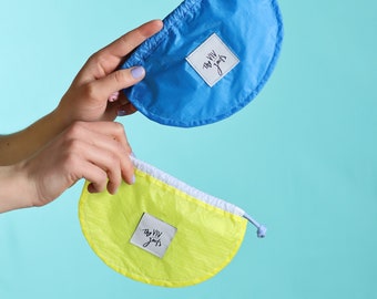 Set of two drawstring pouches made from ultralight recycled ripstop nylon. Perfect as dog treat training bags or simple card wallet