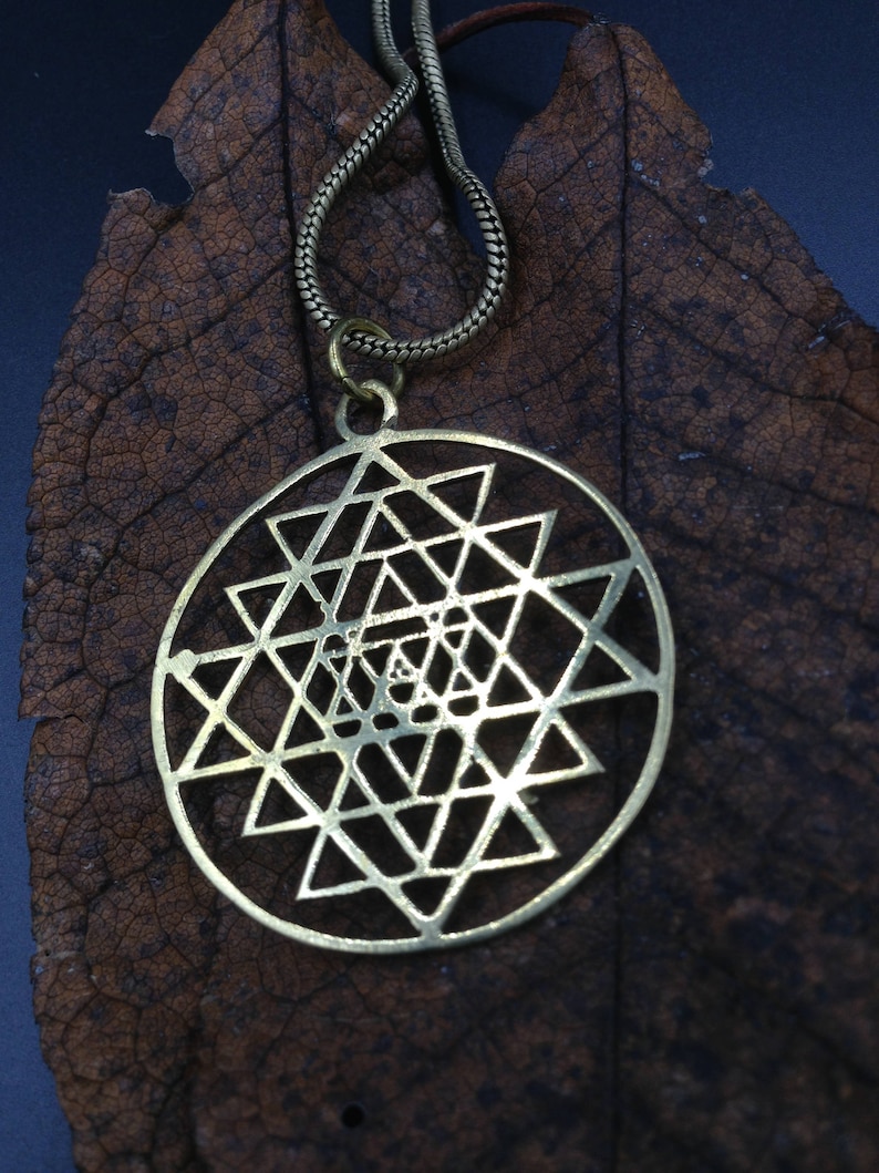 Shri yantra brass pendant.