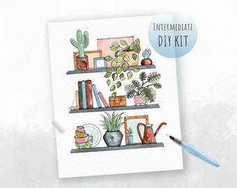 May include: A watercolor illustration of a shelf with three tiers, featuring various plants, books, and decorative items. The top shelf has a cactus, a pink box, a small picture frame, and a hanging plant. The middle shelf has a stack of books, a small wooden box, and a potted plant. The bottom shelf has a stack of bowls, a potted plant, a picture frame, and a red watering can. The illustration is labeled "INTERMEDIATE DIY KIT".