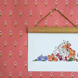 May include: A white framed print of a floral design in the shape of the state of Virginia. The flowers are in shades of orange, red, white, and purple.
