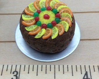 Miniature glacé fruit cake with oranges, lemons, cherries and pineapple. Perfect for Christmas.