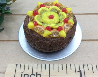 Miniature glacé fruit decorated fruit cake. 1/12 scale