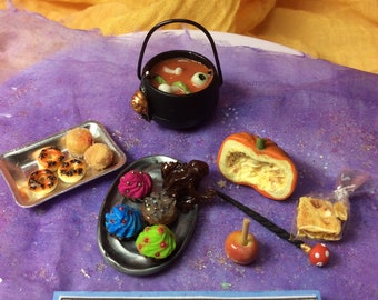 Miniature Witches Cauldron Stew with insects, jelly bones & eyeballs! Ant donuts, chocolate frog, wand, half pumpkin, toffee treats on plate