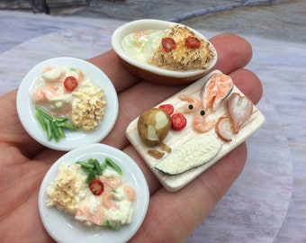 Miniature fish pie making, from start to finished meal. Highly detailed food for dollhouse or diorama with gold coloured cutlery for two.