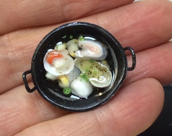 Miniature Wok with fish broth. An assortment of fish cooking in stock.  12th scale miniature for dollhouse, restaurant or diorama.