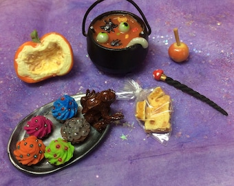 Miniature Witches Treats: Witches Brew Stew, half pumpkin, liquorice wand, chocolate frog, cinder toffee, toffee apple + frogspawn cupcakes