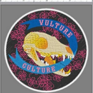 May include: A black and white embroidered patch with a skull and crossbones design. The skull is white with yellow accents and the crossbones are black. The patch is surrounded by a blue ribbon with the text "VULTURE CULTURE" in pink letters.