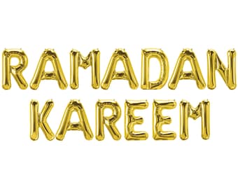 May include: Gold foil balloon letters spelling "RAMADAN KAREEM" on a white background. The balloons are inflated and arranged in two lines, with the top line reading "RAMADAN" and the bottom line reading "KAREEM".