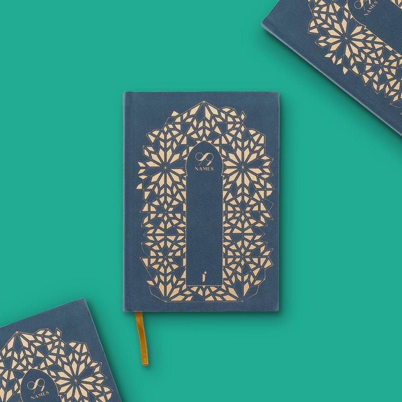 May include: A navy blue journal with a gold geometric design and the text "99 NAMES". The journal has a gold ribbon bookmark. Several journals are arranged on a teal background.