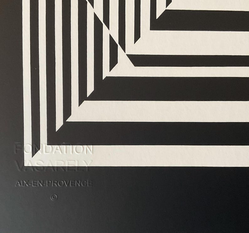 May include: Black and white abstract geometric art print with a white border and the text "Fondation Vasarely Aix-en-Provence" in the bottom right corner.