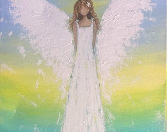 May include: An acrylic painting of an angel with white wings and a white dress. The angel has brown hair and a flower in her hair. The background transitions from blue to yellow and green, with a field of flowers at the bottom.