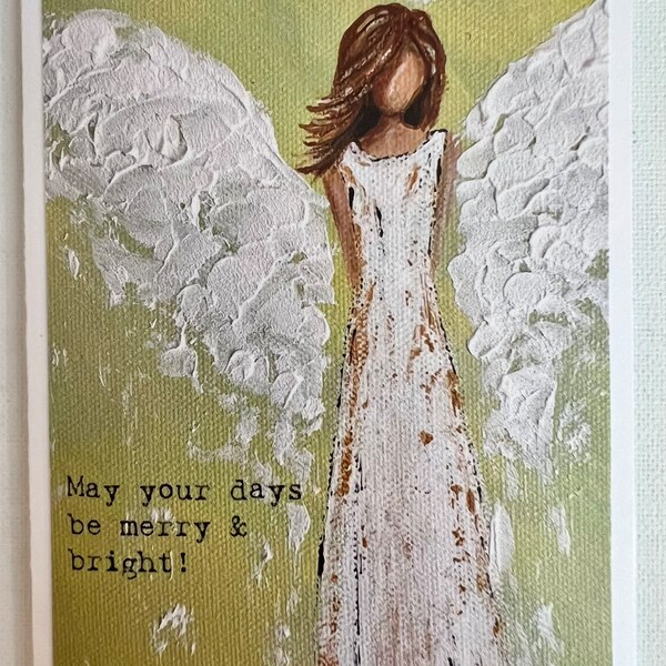 Angel Christmas card on quality paper stock with “May your day be merry & bright” wording.