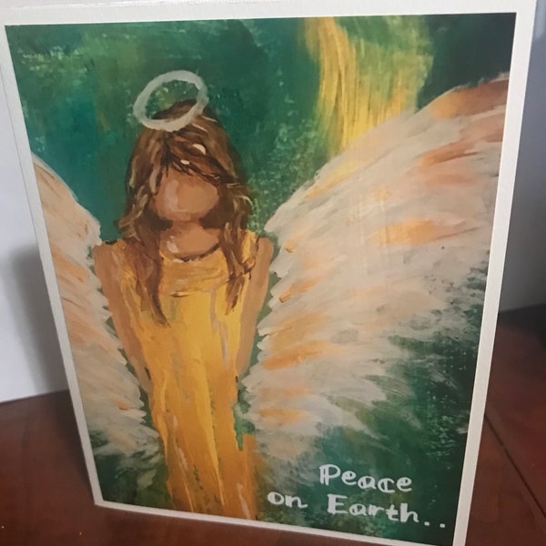 Angel Christmas card on kraft paper stock with "Peace on Earth" wording.